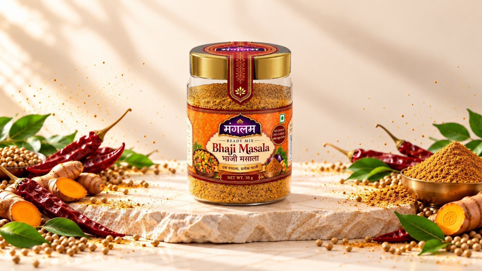 Mangalam Bhaji Masala 40 g Trial Pack jar on a limestone slab with dried chillies and turmeric