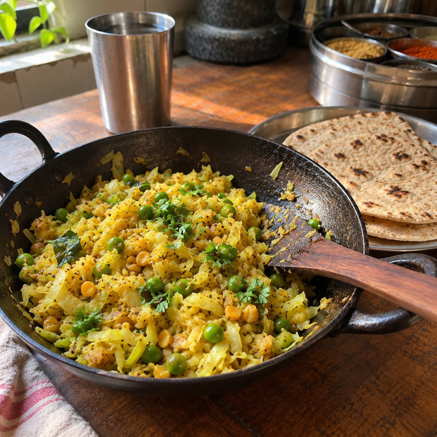 Cabbage sabzi (kobi bhaji) in a brass kadhai